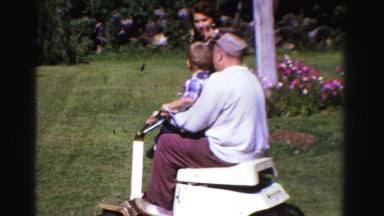 1958: Dad Teaching Son Lawnmowing on Warm Summer Day Minnesota
