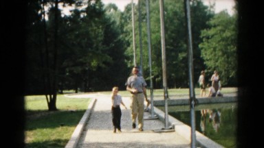 1961: man and boy walking down path HAGERSTOWN, MARYLAND