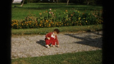 1961: young toddler boy sitting down on gravel sidewalk path HAGERSTOWN