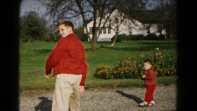 1961: father is seen playing with children HAGERSTOWN, MARYLAND