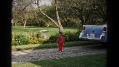 1961: cute toddler boy playing driveway by classic car HAGERSTOWN, MARYLAND