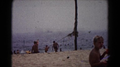 1961: golden sand family beach scene HAGERSTOWN, MARYLAND