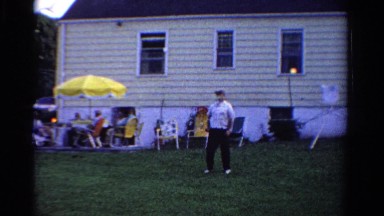 1958: Man and Child Playing Badminton at Summer Barbecue in Minnesota