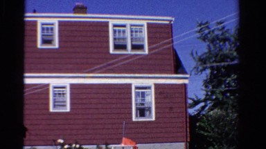 1958: brown house with white windows has clothesline in the backyard MINNESOTA