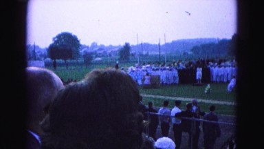 1964: gathering on the meadow to attend ceremony watched by many people