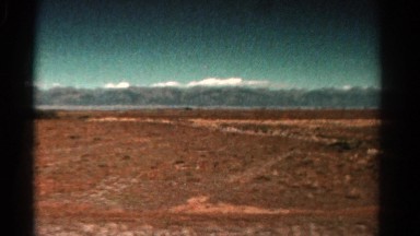 1967: driving open road freedom snow covered mountain long distance background