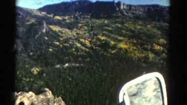 1967: beautiful mountain ridge as seen through the window of vehicle COLORADO