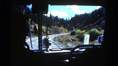 1967: front windshield view of tour bus driving autumn landscape COLORADO