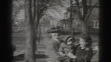 1946: father and mother hold the kid in their hand and daughter approaches