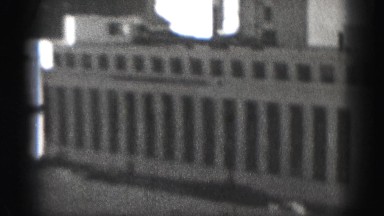 1946: downtown tall concrete and steel buildings reaching towards the sky