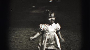 1946: baby girl walking around in dress. HARRISBURG