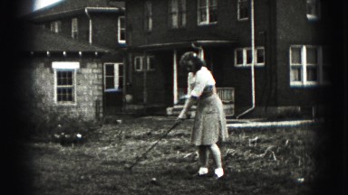 1946: women missing golf ball swinging in barren backyard man hits it far