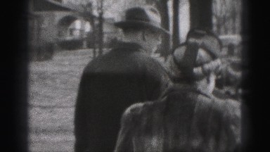 1946: early 20th century man and woman pack car wearing fur coats HARRISBURG