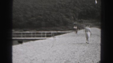 1946: small dog by lake in the woods runs to woman nearby HARRISBURG