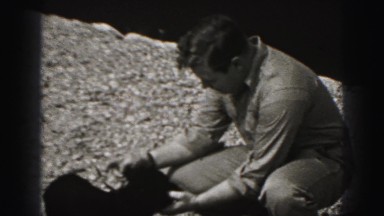 1946: father is seen playing with children HARRISBURG