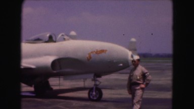 1946: pilots and officers walking and talking at military installation