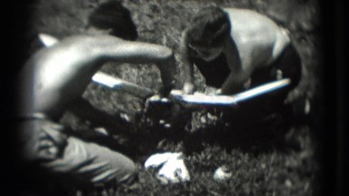 1946: Shirtless Teenage Boys Working on Model Airplane in Summer Sun