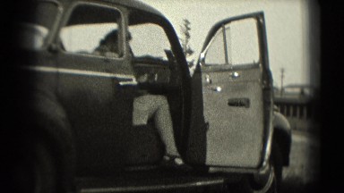 1946: women exits car and waves before cleaning her shoe WASHINGTON, DC