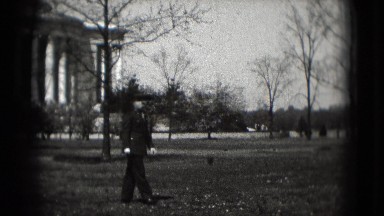1946: uniformed man walks on the lawn near capitol building WASHINGTON, DC