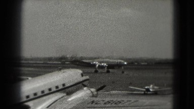 1946: large airplane with four propellers moves down the landing strip