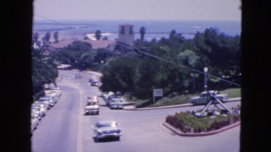 1963: palm tree lined streets of wealthy part of town view from hotel room