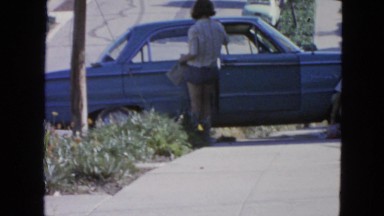 1963: couple is fixing blue car CALIFORNIA