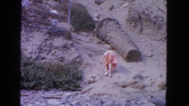 1963: man runs back to help girl up steep steps to see tourist view CALIFORNIA