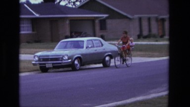 1975: Mom and Toddler Bike Ride in Tandem Safety Seat on Bicycle, California