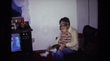 1975: father is seen playing with children CALIFORNIA
