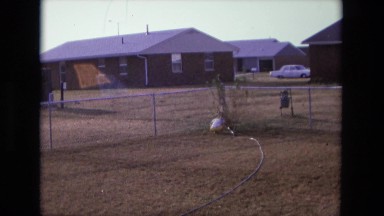 1975: little boy is watering plant CALIFORNIA