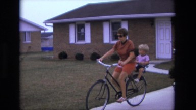1975: mother and son rides bike CALIFORNIA