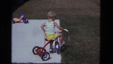 1975: Toddler on Tricycle in Backyard California