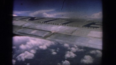 1962: An Airplane Wing Over Cloudy Patch of Sky San Pedro, California