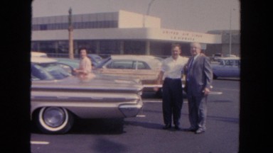 1962: Man Jumps for Picture with Father in San Pedro, California
