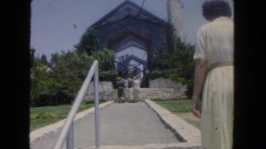 1962: woman walking into church SAN PEDRO, CALIFORNIA