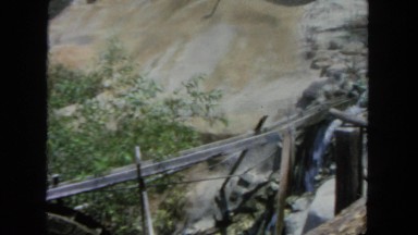 1962: water flows through gold mining area with tourists
