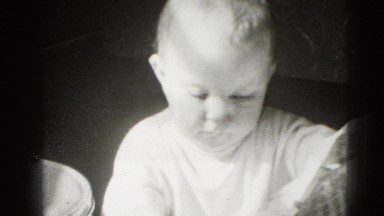 1947: baby chewing on newspaper MIDDLETOWN
