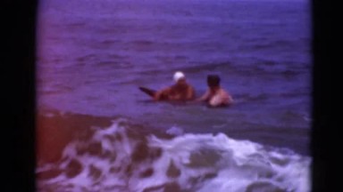1947: couple is having fun in the ocean MIDDLETOWN