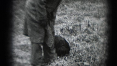 1947: Man in Suit Walking Through Middletown