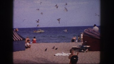 1960: Beach Scene in Florida with Families and Waves