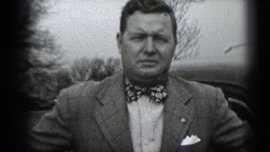1947: Man Adjusting Bow Tie and Walking Away in Middletown
