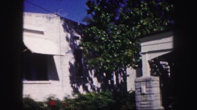 1960: white house with awnings under blue sky FLORIDA