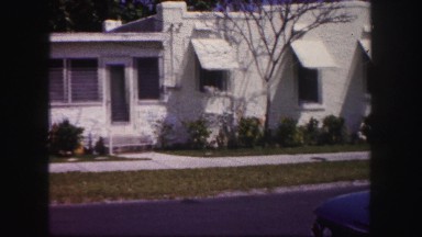 1960: city street lined with simple, small, nondescript houses FLORIDA