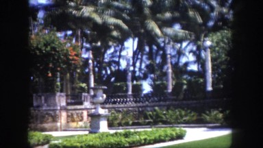 1960: behind the walls of castle is gorgeous white stone house with workers