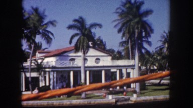 1960: travelling down street in tropical area FLORIDA