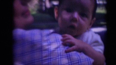 1947: mother holding baby boy in loving arms overlooking shoulder MIDDLETOWN