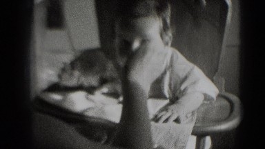1947: baby being fed in highchair. MIDDLETOWN