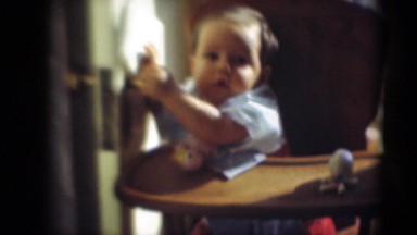 1947: baby in highchair grabbing door MIDDLETOWN