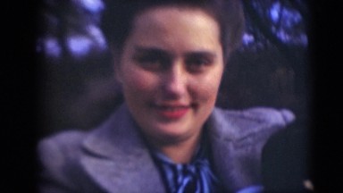 1947: woman holding cute baby wrapped in blue blanket MIDDLETOWN