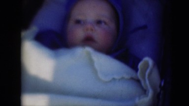 1947: baby smiles in crib stroller carriage in the sunlight MIDDLETOWN